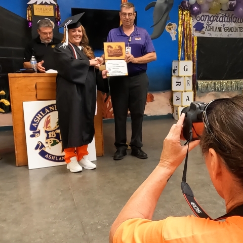 Photo of inmates and staff at ASPC-Perryville Ashland University graduation